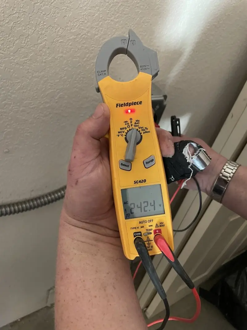 Voltage testing with clamp meter during Outlet Installation in Modesto